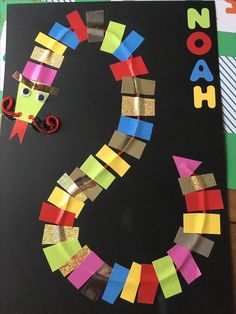 this is an image of a letter s made out of construction paper and colored strips