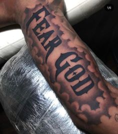 a man's arm with the word fear on it