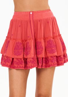 Get ready to turn heads in our Mina Embroidered Mini Skirt! With its bright coral hue and stunning embroidery detailing, this skirt is perfect for dressing up or down. The button front and tiered design add a playful touch and the lightweight linen cotton blend makes it a comfortable choice. Plus, it even has side pockets for added convenience! Pink Embroidered Bohemian Skirt, Bohemian Pink Embroidered Skirt, Summer Floral Embroidery Tiered Skirt, Embroidered Pink Skirt For Summer, Summer Embroidered Pink Skirt, Embroidered Pink Summer Skirt, Embroidered Cotton Mini Skirt For Summer, Cotton Tiered Skirt With Embroidered Hem, Vacation Cotton Skirt With Floral Embroidery