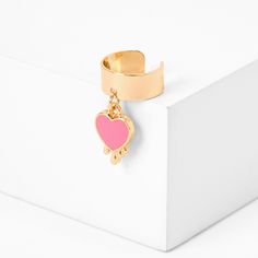 A pretty pink heart charm dangles from this gold-tone cuff to add a fun touch to any outfit. The heart features a pastel enamel finish. Finish: Gold-tone Closure: Cuff Material: Metal - Claire's Pink Heart Charm Gold Ear Cuff Trendy Pink Enamel Jewelry, Trendy Heart-shaped Jewelry For Spring, Spring Heart-shaped Gold Jewelry, Heart Ear Cuff, Hair Mask For Growth, Horse Boots, Gold Ear Cuff, Fashionable Jewelry, Jewelry And Accessories