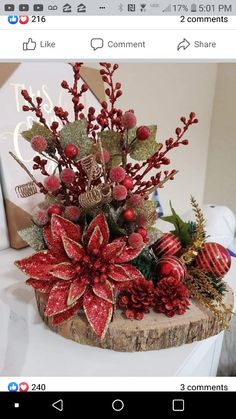 a wooden log with red flowers and greenery on it