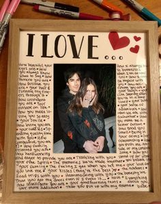 a wooden frame with an image of two people in it and the words i love