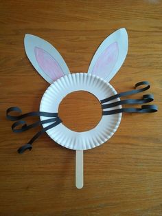 a paper plate with scissors and bunny ears on it