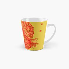 a yellow and red cup with an orange flower on it's side tall mug