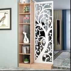 a room divider with an intricate design on the front and back doors in white