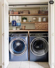 a washer and dryer in a small room with open shelving above them