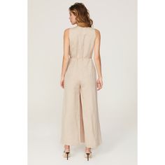 Beige linen blend (55% Linen, 45% Rayon). Jumpsuit. Sleeveless. V-neck. Back zipper closure. 58" from shoulder to hemline. 29" inseam. 19" rise. 25" leg opening. Imported. Spring Linen V-neck Jumpsuit, Spring Linen Jumpsuit With V-neck, Linen V-neck Jumpsuits And Rompers For Spring, Spring Fitted Linen Jumpsuits And Rompers, Fitted Linen Jumpsuits And Rompers For Spring, Elegant Sleeveless Linen Jumpsuit, Chic Beige Linen Jumpsuits And Rompers, Rosetta Getty, Linen Jumpsuit