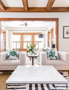 a living room with two couches and a coffee table