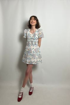 "Vintage mini dress from KBC. Smock detailing at the waist and buttons on the front!  Excellent vintage condition! *Clothes have been fitted to model please check sizing* Measurements - Bust - 32\" Waist - 31\" Length - 32\"" Vintage Mini Dress For Day Out, Vintage Floral Print Mini Dress For Day Out, Fitted Casual Vintage Mini Dress, Casual Vintage Mini Dress For Summer, Spring Mini Dress With Fitted Waist, Retro Knee-length Mini Dress For Day Out, Vintage Mini Dress With Buttons, Daywear Mini Dress With Buttons, Vintage V-neck Mini Dress For Daywear