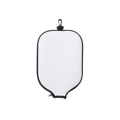 an empty white board with black trim on the bottom and back end, hanging from a hook