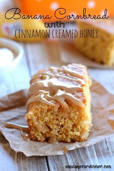 banana cornbread with cinnamon creamed honey on a piece of wax paper next to a cup of coffee