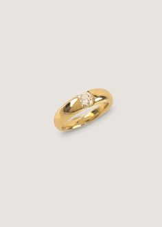 a yellow gold ring with a single diamond