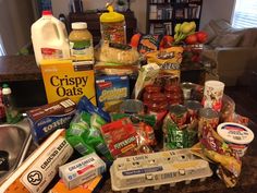 an assortment of food items sitting on top of a kitchen counter