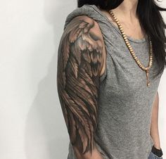 a woman with a tattoo on her arm