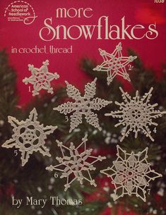 a book with crochet snowflakes on it