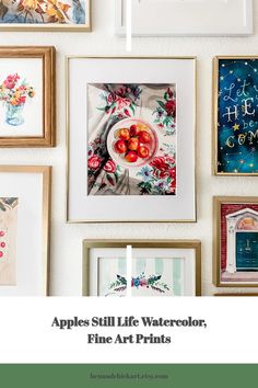 some framed pictures are hanging on the wall with text that reads apples still life watercolors fine art prints