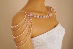 a mannequin with pearls and beads on it