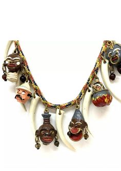 RARE Vintage Head hunter safari jungle collectible polychrome charm necklace WITH POLYCHROME enameled heads and tiger claws Think retro; Gilligan's Island! This is most probably movie memorabilia from the 1930's. Very colorful enamels and charming characters befitting a jungle head hunter scene! The necklace has a fancy clasp closure and is on it's original multiple colored cord. This would be the talk of any costume jewelry collection! Vintage 1930's Head Hunter Necklace with Enameled Metal Cha Collectible Bohemian Multicolor Necklace, Traditional Multicolor Collectible Necklaces, Bohemian Multicolor Collectible Necklaces, Multicolor Bohemian Collectible Necklace, Bohemian Multicolor Collectible Necklace, Collectible Multicolor Charms Jewelry, Multicolor Charm Jewelry For Collectors, Head Hunter, Rare Gifts