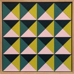 an abstract painting with green, pink and yellow triangles