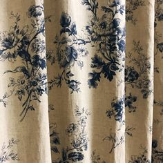 a curtain with blue and white flowers on it