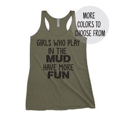 a women's tank top that says girls who play in the mud have more fun