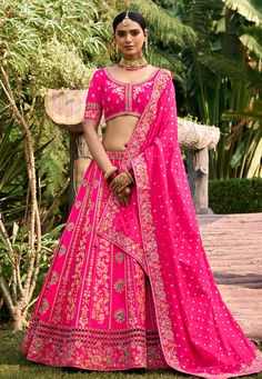 Magenta banarasi silk wedding lehenga choli 6801  Desc:  Style : Circular Lehenga Choli Color : Magenta Fabric : Banarasi Silk Work : Sequence   Embroidery Wash Care : Dry clean Sleeve Style : Half Sleeve Long Sleeves : Done only in Custom Stitch Sleeves Lining : Done only in Custom Stitch Bust Size : 32 to 42 Inches Occasion : Wedding   Mehendi   Sangeet   Engagement   Reception   Ceremonial   Baby Shower. With Express Free Shipping and Custom Stitching, Buy Lehenga - Indian Party wedding and bridal  Magenta banarasi silk wedding lehenga choli 6801 online in USA, UK and Canada from KollyBollyEthnics.com Raw Silk Choli For Wedding, Dola Silk Lehenga For Wedding, Wedding Dola Silk Lehenga, Raw Silk Meenakari Choli For Receptions, Meenakari Sharara For Wedding, Traditional Drape Lehenga With Meenakari For Reception, Fitted Meenakari Lehenga For Reception, Traditional Drape Meenakari Choli For Reception, Wedding Lehenga In Cutdana Raw Silk