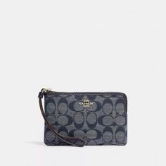 This Coach Corner Zip Wristlet In Signature Chambray Is A Stylish Accessory For Women. It Features A Denim Multi/Gold Tone Hardware And A Strap With A Zipper Accent. The Wristlet Has Enough Space For Credit Cards And A Wrist Strap For Convenience. It Measures 6.25" In Length And 4" In Width, With A Height Of 1/2". The Fabric Type Is Denim And The Material Is Also Denim. The Item Comes In A Set Of 2 And Is Not Handmade. It Is A Perfect Addition To Any Collection And Is Ideal For Everyday Use. New Coach Blue Wristlet For Travel, Blue Coach Wristlet For Daily Use, Coach Blue Wristlet For Daily Use, Wrist Strap, Stylish Accessories, Credit Cards, Blue Gold, Chambray, Coaching