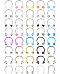 various colors of surgical piercings on white background