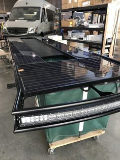 a truck with solar panels on it in a warehouse