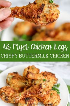 an air fryer chicken leg is being held up over a plate with other food items