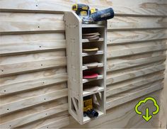 a wooden shelf with several pairs of shoes on it next to a wood paneled wall