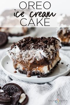 a piece of ice cream cake on a plate with oreo cookies around the edges