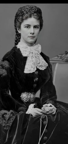 an old black and white photo of a woman