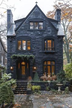 a large black house with lots of windows