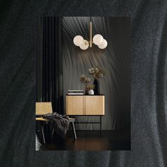 a room with a chair, table and lamp on the wall next to black curtains