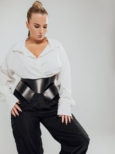 The model is wearing a size XL and is 33.5"/85 cm waist, 35"/89 cm underbust.Stand out from the crowd with this stunning Wasp Corset Belt. Its versatile design allows you to wear the buckles facing back or front, creating a bold and edgy look that's perfect for any occasion. The Wasp design hugs your torso to sculpt a dramatic hourglass waistline. High Waist Corset Belt For Party, Black Belt With Removable Buckle, Elegant Black Corset Belt For Cosplay, Black Fitted Corset Belt With Belt Included, Black Fitted Belt For Night Out, Fitted Corset Belt For Night Out, Chic Black Belts, Fitted Black Corset Belt With Belted Detail, Black Corset Belt For Night Out