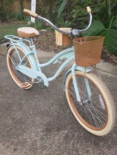 a blue bicycle with a basket on the front