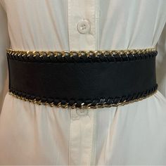 Black Faux Leather Elastic Waistband Gold Tone Braided Chain Belt Color: Black, Gold Tone Material: 50% Faux Leather, 50% Elastic Please Notice: White Shirt Is Not Included, Listing Is For The Belt Only. Warning: P65 (See Last Picture) All Measurements Are Approximate And Taken Laying Flat: Length: 29 Inches Width: 2 1/2 Inches Tags For Exposure: Chunky Black Gold Black Belt Waist Belt Western Wide Location: Tote: #2 Black Chain Belt For Night Out, Adjustable Black Metal Chain Belt, Trendy Black Chain Belt For Night Out, Chic Adjustable Chain Belt, Adjustable Chain Belt For Formal Occasions, Chic Black Chain Link Belt, Edgy Black Metal Chain Belt, Black Metal Chain Belt For Night Out, Adjustable Black Chain Belt With Chain Strap