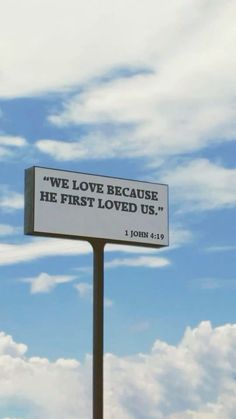 a sign that says we love because he first loved us