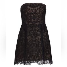 a black dress with an intricate lace pattern