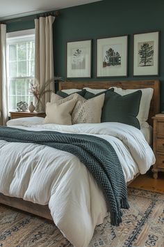 Ocean-inspired bedroom with deep sea green wall and white decor. Green Wall Farmhouse Bedroom, Guest Bedroom Navy Blue, Bedroom Decor Ideas With Dark Furniture, Emerald Green Accents Bedroom, Hunter Green Master Room, Modern Rustic Primary Bedroom, Dark Green Accents Bedrooms, Statement Wall With Window, Green Wall Master Bedrooms Decor