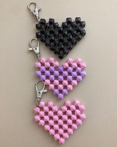 two hearts made out of lego blocks on a table