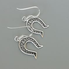 ONE PAIR of sterling silver horse shoe ear danglers. Dimensions: 12 x 17 mm Drop Length: 27 mm Weight: 1.06 gm These earrings are made of 925 hypoallergenic sterling silver. Please note this price is for ONE PAIR only. All my pieces are sent in a gift box. I can include a personal message from you if needed You are welcome to contact me at... bhavnakwintra1956@gmail.com For more beautiful pieces from my shop, please browse 👇 TOE RINGS: https://www.etsy.com/your/shops/TheSilverGame/tools/listing Silver Hypoallergenic Jewelry For Good Luck, Hypoallergenic Silver Good Luck Jewelry, Elegant Horseshoe Earrings For Gift, Silver Horseshoe Jewelry Gift, Elegant Sterling Silver Jewelry With Horse Design, Horse Shoe Earings, Goodluck Charms, Silver Horseshoe Charms Jewelry, Nickel-free Horseshoe Sterling Silver Jewelry