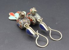 Vintage Afghan Turkmen traditional handmade Alpaka enamel colored bird earrings. Please do not hesitate to contact if you have any questions or further informations.  Measures Length : 3.1" ( 8cm ) Width : 0.9" ( 2.2cm ) Weight : 11.4 Grams, Please know what you are bidding on! The metal of Most Kuchi, Afghan and Turkoman items are called with different names, Some called Alpaca silver, German Silver and Tibetan Silver. They do not give any allergies or body reaction . I recieve large shipments Traditional Enamel Drop Earrings, Multicolor Bird Design Earrings As A Gift, Multicolor Bird Design Earrings For Gift, Multicolor Bird Design Earrings Gift, Gift Multicolor Bird Design Earrings, Earrings Bird, Bird Shape, Vintage Afghan, Bird Earrings