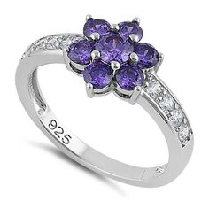 Top of ring height: 11mm

         Top of ring width: 9mm

      Band width:  3mm

      Shank width: 2mm

    
        Stone material:  purple & clear cubic zirconia

      Center stone size: 4mm  

      Stone shape:  round

      Center stone carat    weight: 0.3 ct.

      Total number of CZ    stones: 8

      Stone setting:  prong setting

   
       Metal:  925 sterling silver

      Plating:  rhodium plated    (what is rhodium?) What is Rhodium? 
 
   If you're no Purple Cubic Zirconia Round Cut Rings, Purple Flower Ring For Anniversary, Lavender Amethyst Ring With Cubic Zirconia, Lavender Cubic Zirconia Ring With Center Stone, Purple Cubic Zirconia Crystal Promise Ring, Cubic Zirconia Flower Ring With Center Stone, Purple Cubic Zirconia Crystal Ring With Center Stone, Purple Flower Rings For Anniversary, Purple Cubic Zirconia Promise Ring