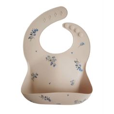 a white bib with blue flowers on it