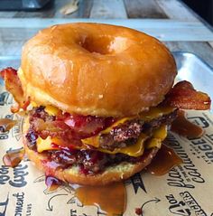 a bacon cheeseburger on a bagel bun