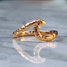 24K Gold plated Wave Ring with a hammered textured finish. Embrace the summer vibe with this ocean inspired wave ring. A perfect gift for beach lovers and surfers. Available in 925 Sterling Silver https://etsy.me/2MtmxmI Available in Brass https://etsy.me/2FUss2O Ring Size Available in all sizes. Please be sure to find your exact ring size for the finger you want before ordering. See image chart above or you can use the chart on my website as a guide - https://jewelrylab.co/pages/ring-sizing-tip Wavy Gold Rings For Gift, Gold Wavy Rings For Gifts, Pinky Rings For Women, Gold Wave Ring, Gold Pinky Ring, Mens Pinky Ring, Hawaiian Jewelry, Hammered Ring, Womens Ring