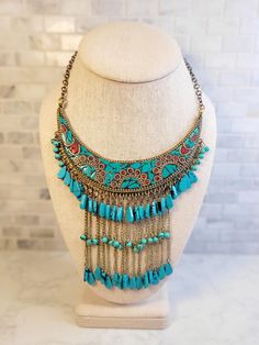 This beautiful one of a kind statement necklace will add a bohemian flare to any outfit! Definitely an eye catcher. The Bib is  4.5 inches wide with 4 inch drop. The necklace has a total length of 14 inches with a little over a 6 inch drop. Bohemian Turquoise Necklace With Colorful Beads For Gift, Bohemian Beaded Necklaces With Dangling Beads, Handmade Multicolor Bohemian Turquoise Necklace, Red Beaded Bohemian Bib Necklaces, Bohemian Turquoise Bib Necklace With Colorful Beads, Festival Turquoise Necklace With Dangling Beads, Bohemian Turquoise Jewelry For Festivals, Red Bohemian Bib Necklace For Festivals, Bohemian Turquoise Necklace With Dangling Beads For Festival