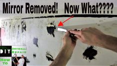 a man is painting a wall with black paint and the words mirror removed now what?